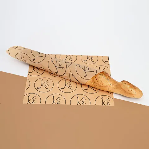Baguette wrapped in kraft greaseproof paper printed with a one-color logo repeat